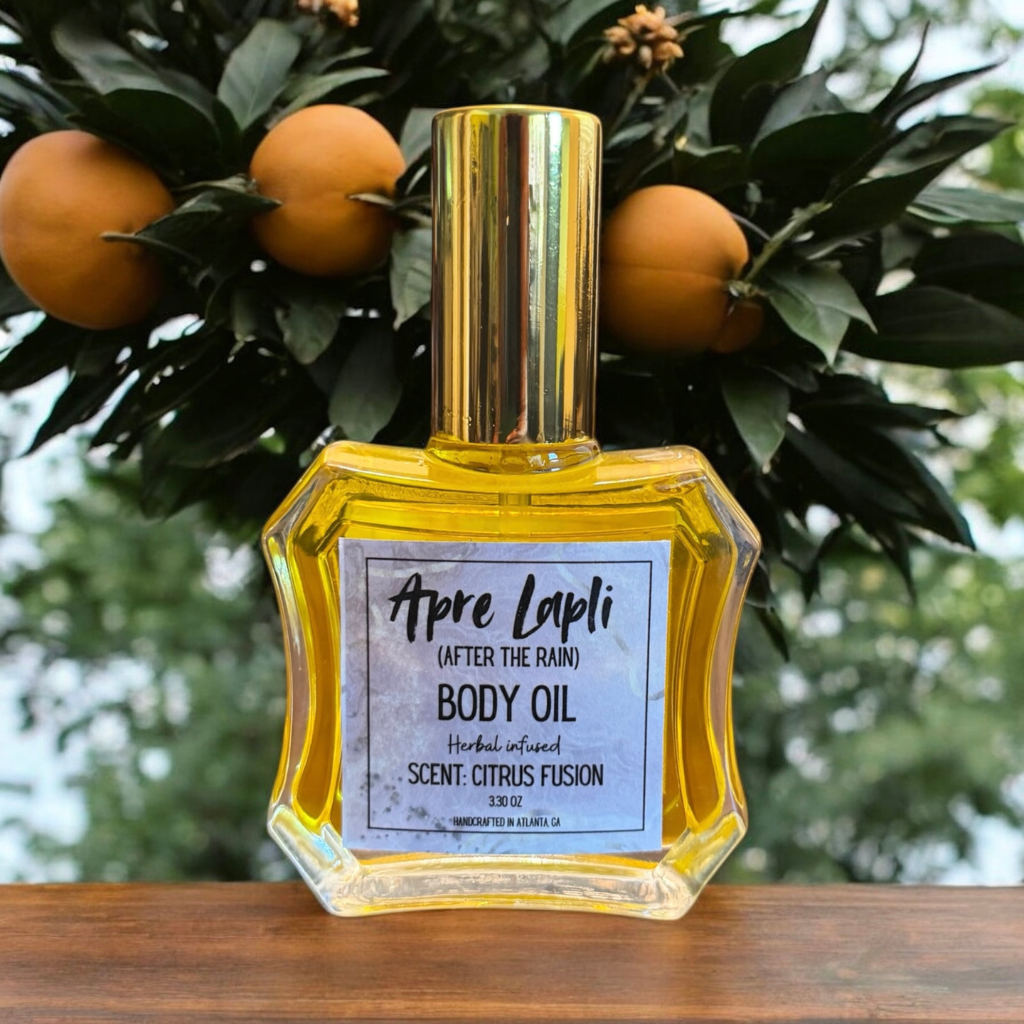 Body oil bottle labeled 'Apre Lapli' with oranges and greenery in the background