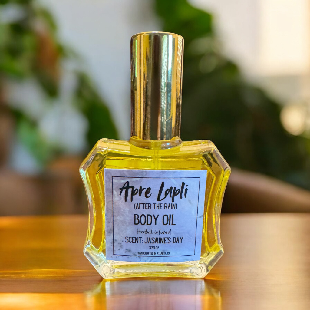 Bottle of Apre Lapli body oil on a wooden surface with a blurred green background