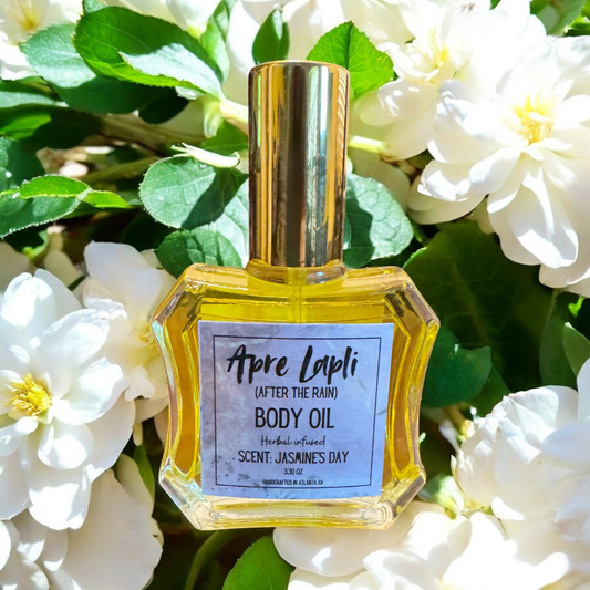 Body oil bottle with a gold cap on a floral background