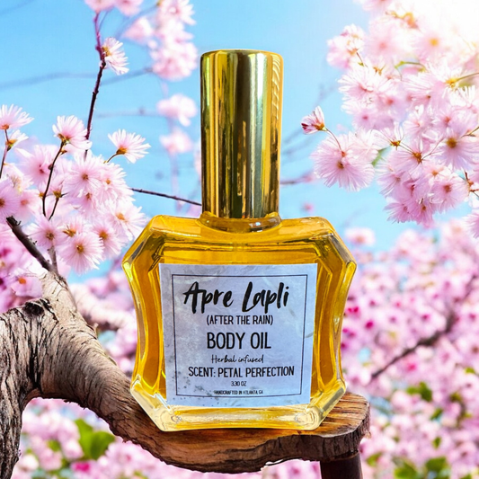 Apre Lapli body oil bottle with cherry blossoms in the background