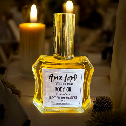 Body oil bottle labeled 'Apre Lapli' with candles in the background